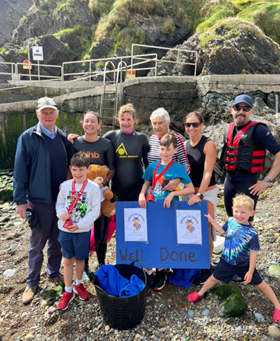 Best of luck to 2 of couch2cave swimmers Emer & Jane who are both swimming across Tramore Bay this morning towing "junior"  (2)